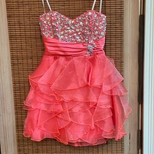 Pink strapless dress with ruffles and beading